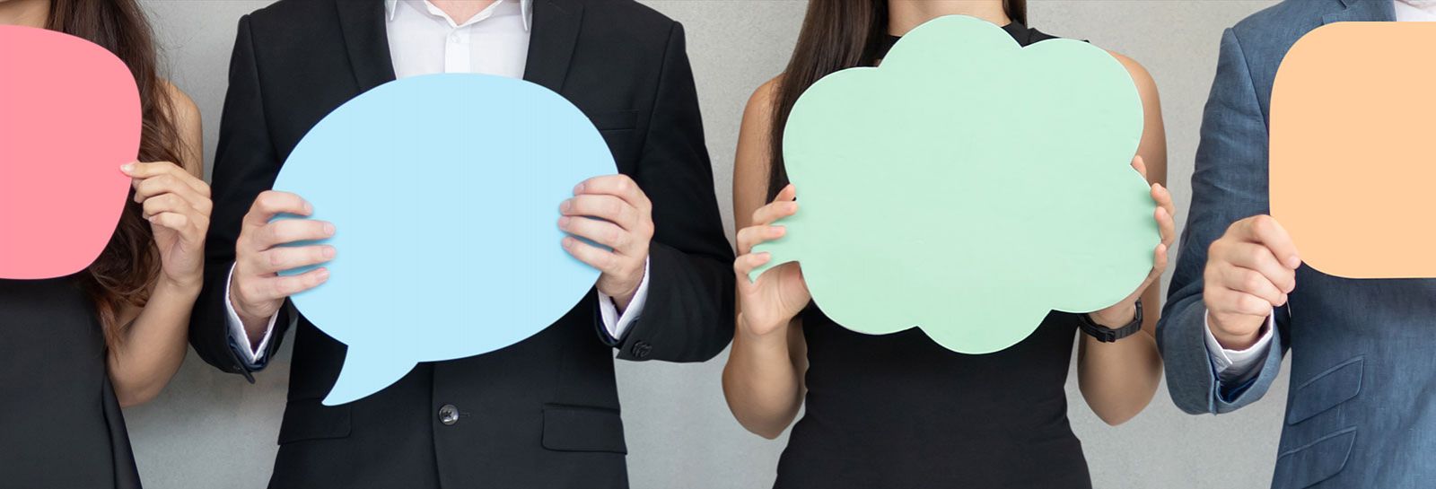 People holding cardboard speech bubbles banner image