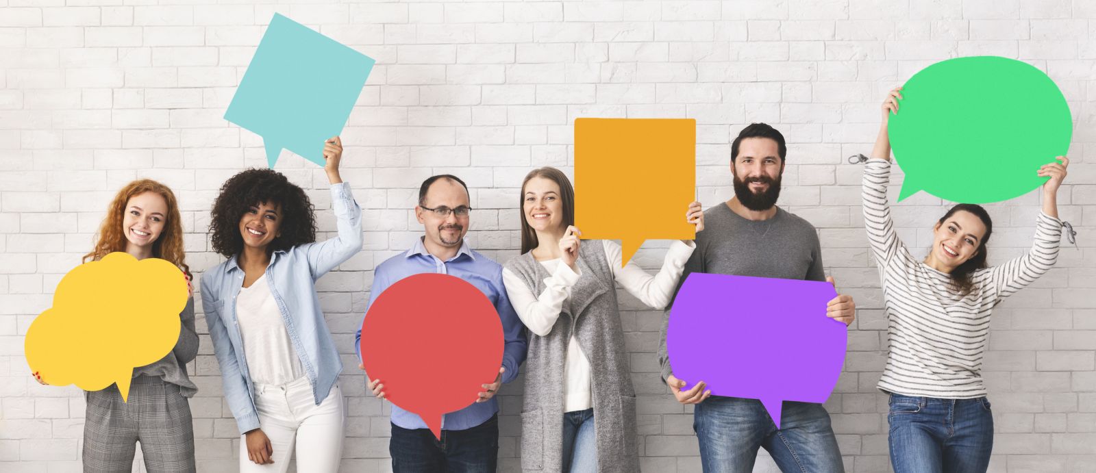 Group of people holding speech bubbles banner image