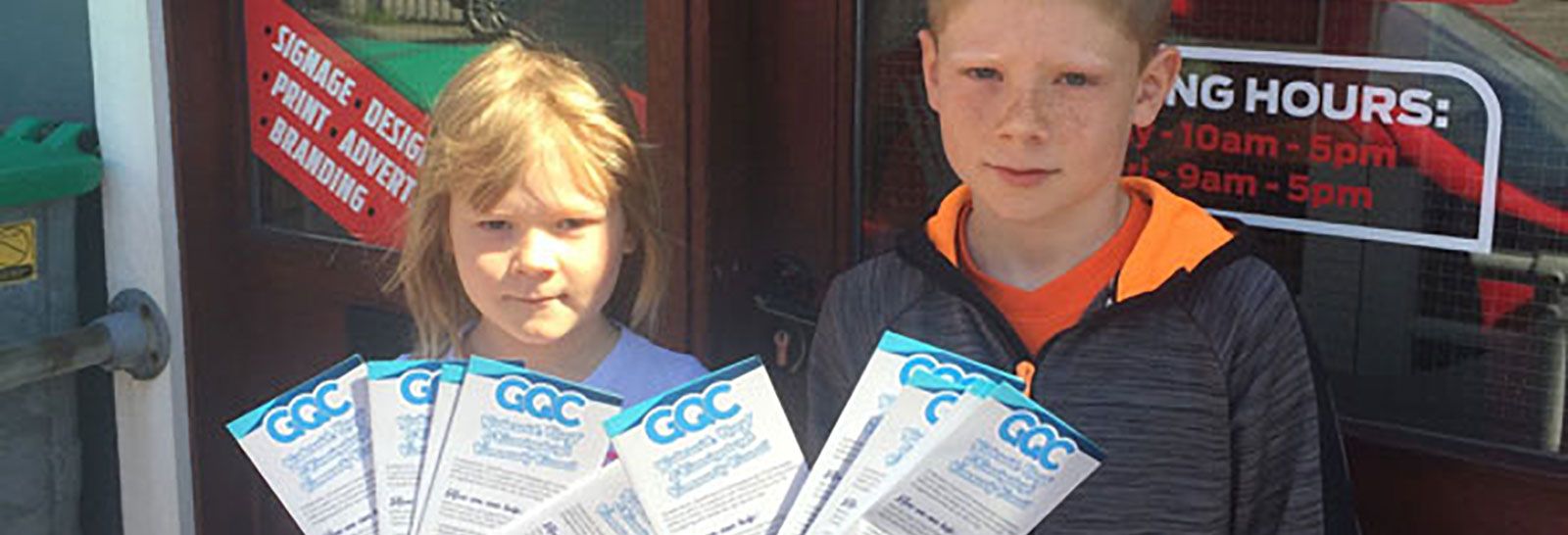 Katie and Fraser Geddes with leaflets from Art Machine Shetland banner image