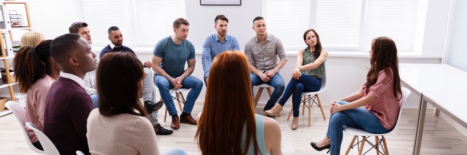 Group of people meeting in person in community banner image