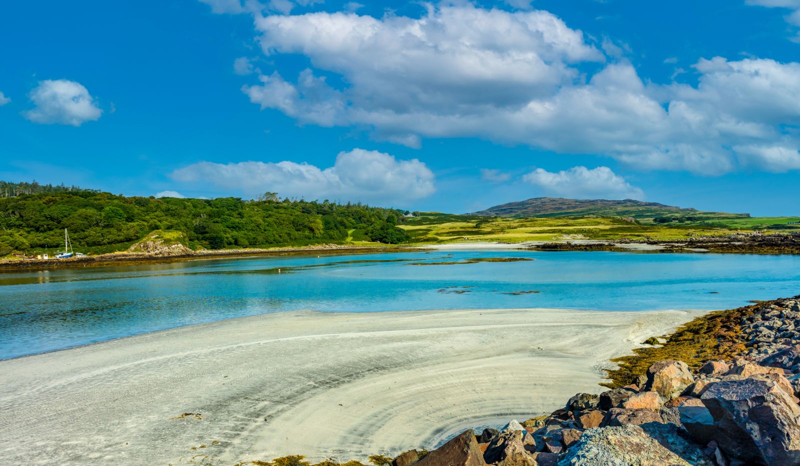 View across a beach on the island of Eigg banner image