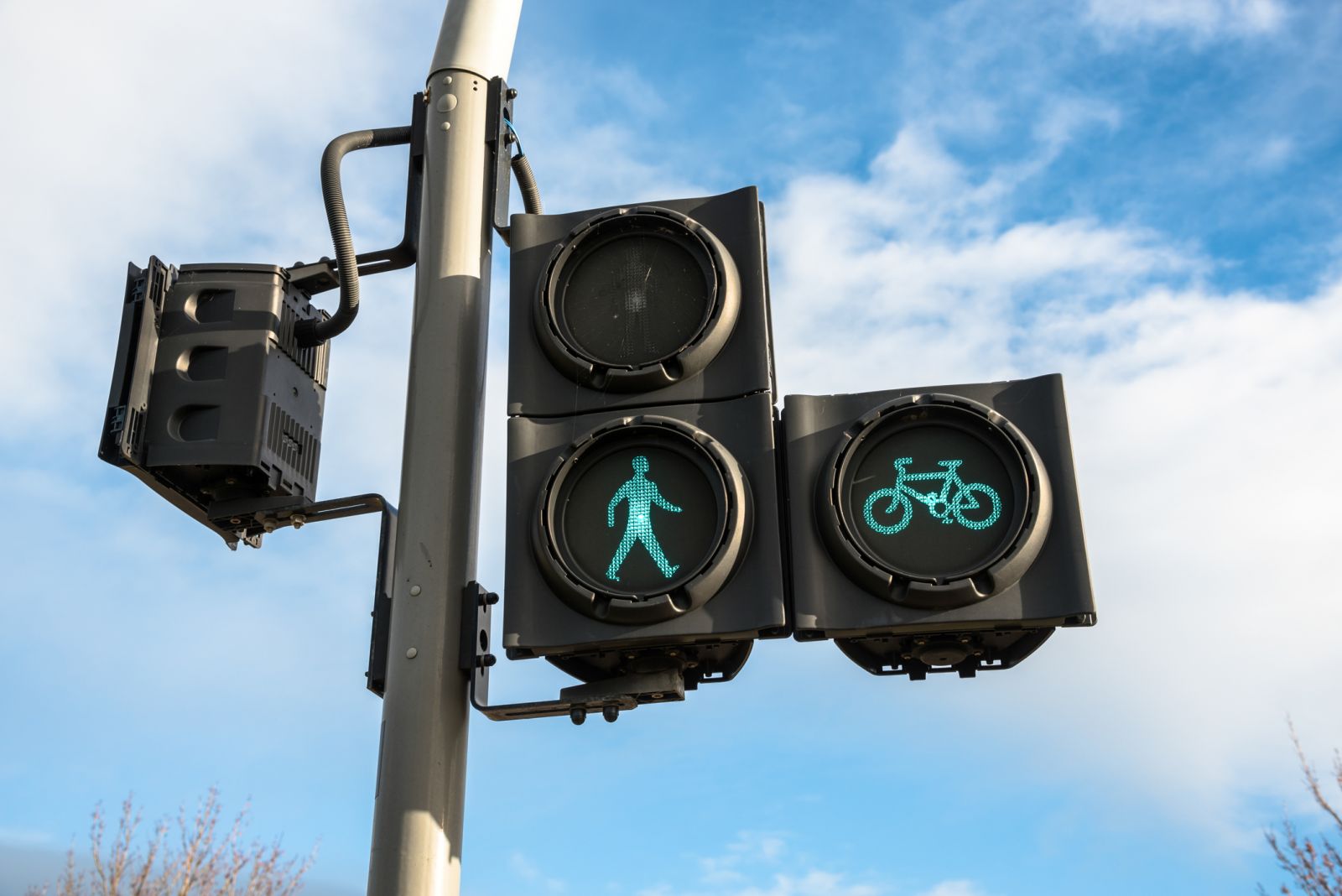 Pedestrian and cyclist traffic signal on green light banner image