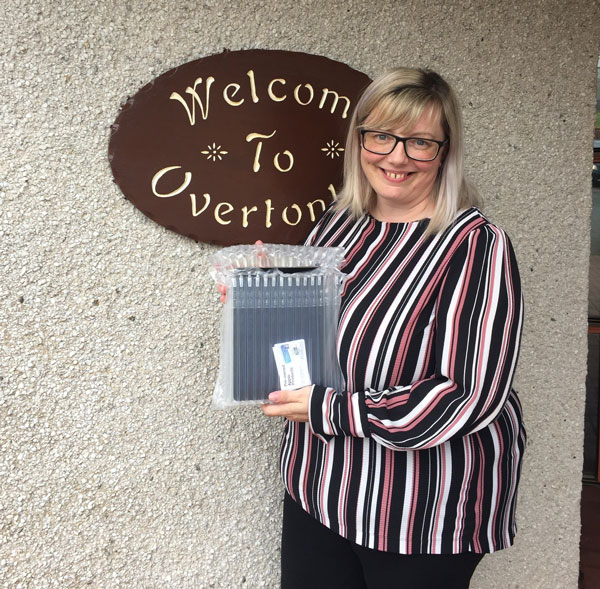 Amanda Malcolmson, Team Leader - Overtonlea Services, receiving iPads purchased by the CC on their behalf.