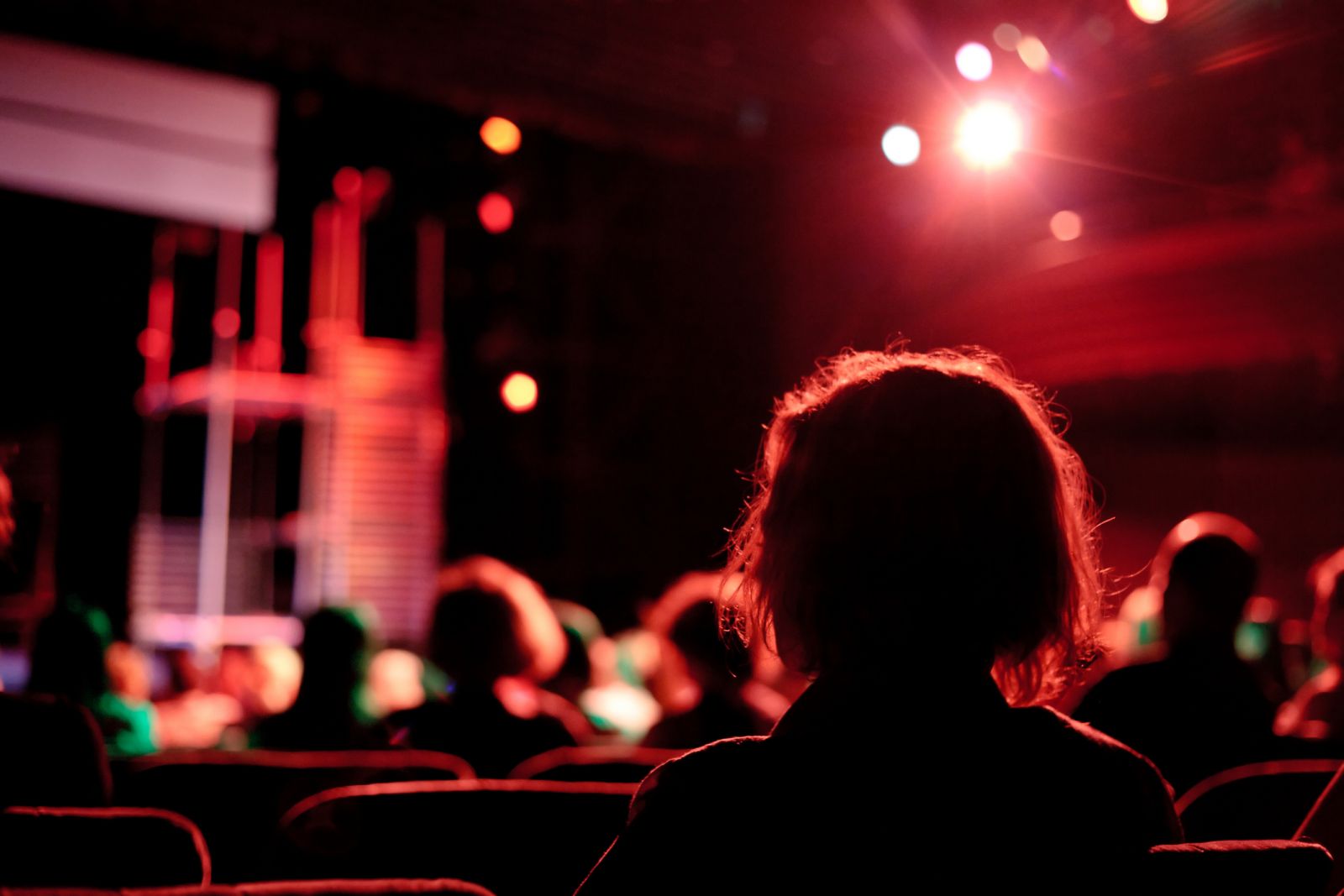 Woman in audience at theatre banner image